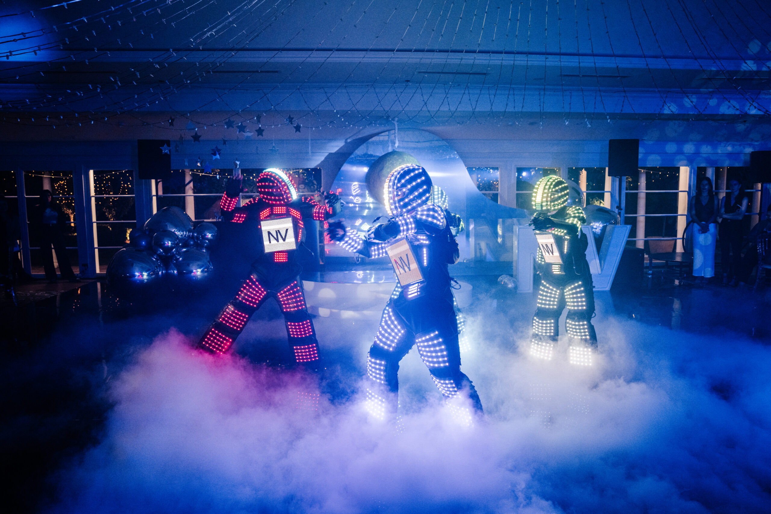 Corporate - LED robots with lyra pole